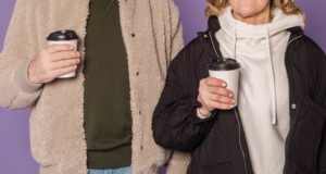 couple holding cup of coffee