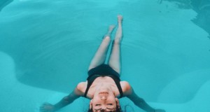 woman in black tank top in water